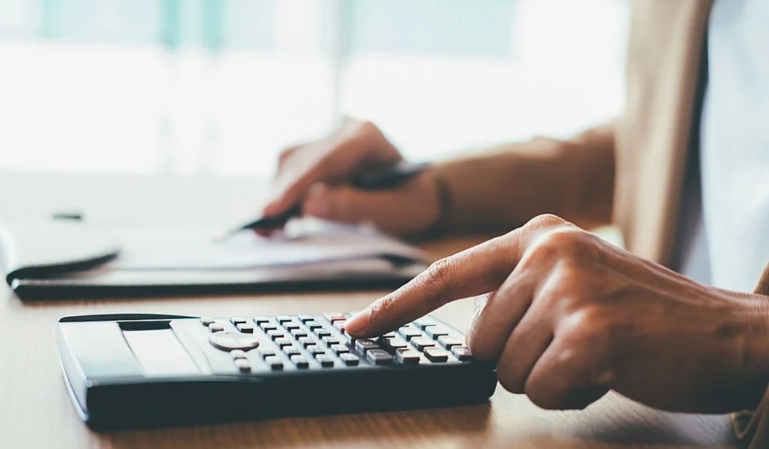 Office worker calculating costs